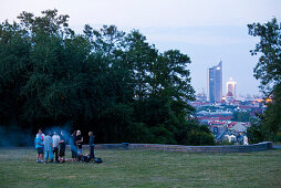 Young people on hill Fockeberg in the evening, Leipzig, Saxony, Germany