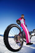 Snow biking, Chiemgau, Bavaria, Germany