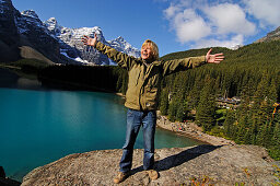 Exulting boy,  Moraine Lake, Banff National Park, Alberta, Canada