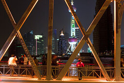 The illuminated Waibaidu bridge above the Souzhou canal at night, Bund, Shanghai, China, Asia