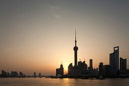 Skyline of Pudong at Huangpu river at sunrise, Pudong, Shanghai, China, Asia