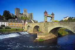 View over Lahn river with stone bridge to castle ruin, Runkel, Hesse, Germany