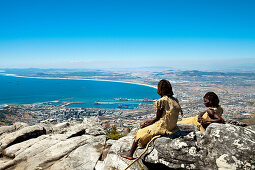 Two African women in traditional clothes on Table Mountain, View towards Cape Town, Western Cape, South Africa, Africa