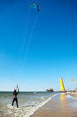 Kitesurfing near beach, Sankt Peter-Ording, Schleswig-Holstein, Germany