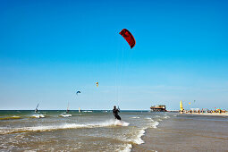 Kitesurfing near beach, Sankt Peter-Ording, Schleswig-Holstein, Germany