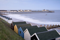 Beach huts and Pier in Southwold, East Anglia, Suffolk, England, Great Britain, Europe