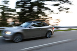 Cabrio passing Black Forest High Street in the morning, Black Forest, Baden-Wuerttemberg, Germany