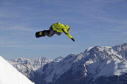 Snowboader jumping, Crap Sogn Gion, Laax, Grisons, Switzerland