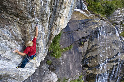 Man climbing on granite rock, Stubaital, Tyrol, Austria