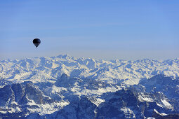 Hot-air balloon flying high above Dolomites and Tauern range with Grossglockner, aerial photo, Dolomites, Venetia, Italy, Europe