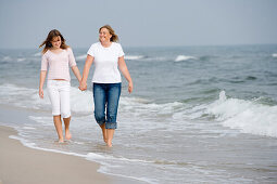 Women walking on beach