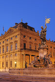 Illuminated fountain Frankoniabrunnen and Wuerzburger residence in the evening light, Wuerzburg, UNESCO World Heritage Site Wuerzburg, Bavaria, Germany