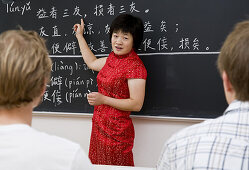 Chinese teacher teaching german students, Confucius Institute Leipzig, Leipzig, Saxony, Germany