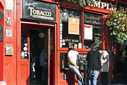 Visitors in front of an Irish pub, Temple Bar area, Dublin, County Dublin, Ireland