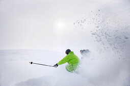 Male free skiers in deep snow, Mayrhofen, Ziller river valley, Tyrol, Austria