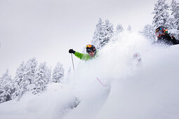 Male free skiers in deep snow, Mayrhofen, Ziller river valley, Tyrol, Austria