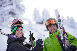 Two male free skiers smiling at camera, Mayrhofen, Ziller river valley, Tyrol, Austria
