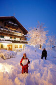 Mother with daughter in snow, Hotel Chesa Valisa, Hirschegg, Kleinwalsertal, Vorarlberg, Austria