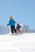 Children skiing, Schlosslelift, mount Barenkopf in background, Hirschegg, Kleinwalsertal, Vorarlberg, Austria