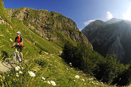 Mountain biker at summit of Corno Grande, Gran Sasso National Park, Abruzzi, Italy, Europe