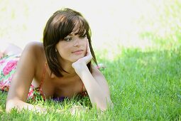 Absorbed, Adult, Adults, Brunette, Brunettes, Calm, Calmness, Caucasian, Caucasians, Color, Color image, Colour, Contemporary, Country, Countryside, Dark-haired, Daytime, Dress, Dresses, exterior, Female, Garden, Gardens, Girl, Girls, Grass, Horizontal, h