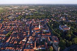 Aerial view of Celle castle and gardens, red roofs of the old town, church of St. Marien and avenue of trees in the French garden, Celle, Lower Saxony, Germany