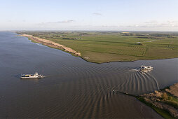 Aerial of a car ferry at the junction of the Süderelbe at Wischhafen and the Lower elbe, Lower Saxony, Germany