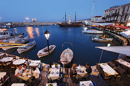 Restaurant, old venetian port in the evening, Rethymnon, Crete, Greece
