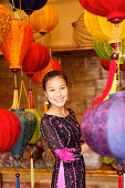 Woman inside a lampion store, Hoi An, Annma, Vietnam