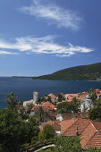 View over the roofs of the old town of Herceg Novi onto the Bay of Kotor, Montenegro, Europe