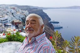 Actor Mario Adorf on a terrace near Fira, (on the occasion of shooting for ARD Degeto-Mona Film Production) Santorini, Greece, Europe