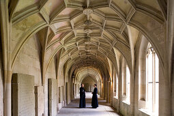 Monks at cloister at Bebenhausen monastery, Bebenhausen, Tübingen, Baden-Württemberg, Germany, Europe