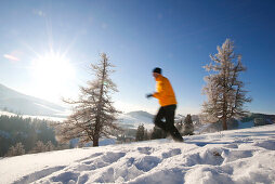 Man jogging on snow, Styria, Austria