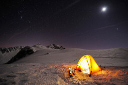 Illuminated tent on snow face under starry sky, Passo Giau, Cortina d' Ampezzo, UNESCO World Heritage Site Dolomites, Dolomites, Venetia, Italy, Europe