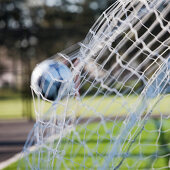 Soccer Ball in Goal Netting, Tukwila, Washington, USA