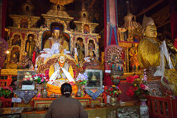 Golden Buddha statues in the Prayers hall at Drepung monastery n, Tibet Autonomous Region, People's Republic of China