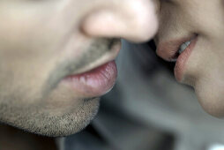 Couple preparing for kiss, close-up