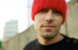 Man wearing red hat, close-up, blurred