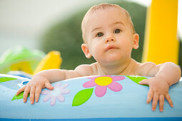 Portrait of a baby in a little pool