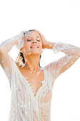 Young woman under a shower