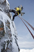 Snowboarder rappeling, Chandolin, Anniviers, Valais, Switzerland