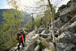 Hikers on a track at Mount Hrebienok, High Tatra, Slovakia, Europe