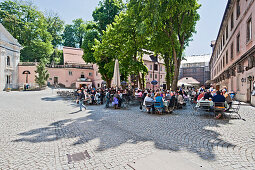 People at outdoor seating of the restaurant of Weltenburg monastery, Kelheim, Bavaria, Germany, Europe