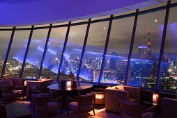 Blue light reflections in windows of Three Sixty Bar of Millennium Hilton Hotel, Bangkok, Thailand