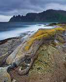 Steep and rugged mountains rising straight from the sea, Erstfjord, Senja island, Troms, Norway