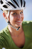 Woman wearing cycle helmet, Lake Starnberg, Bavaria, Germany