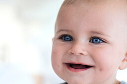 Portrait of a baby smiling, indoors