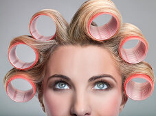 Young woman in curlers