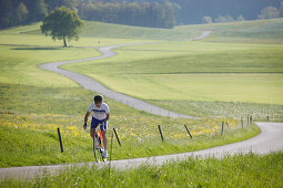 Cyclist near Muensing, Bavaria, Germany