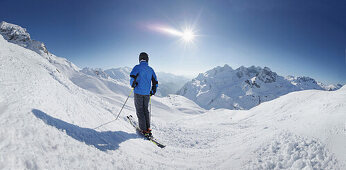 Skier in front of a mountain Panorama, Zuers, Arlberg, Austria
